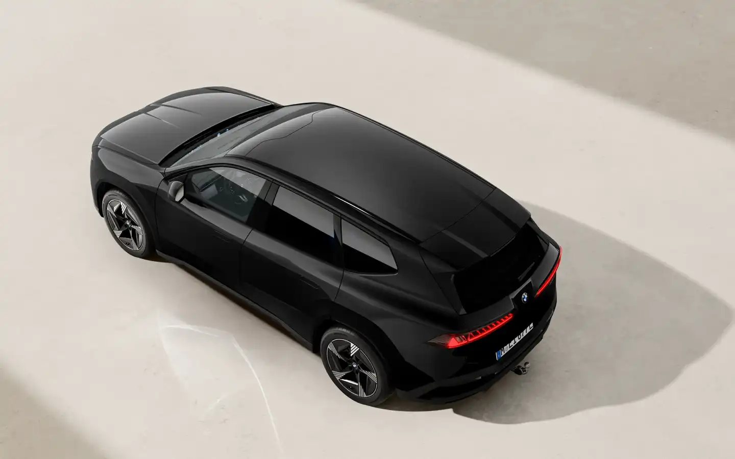 Schwarzer BMW iX3 neue Klasse mit vibe Kennzeichen.